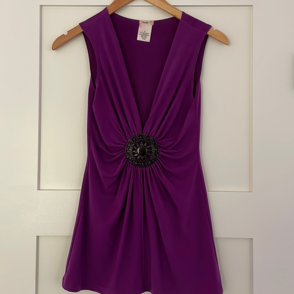Purple tank with black metal medallion